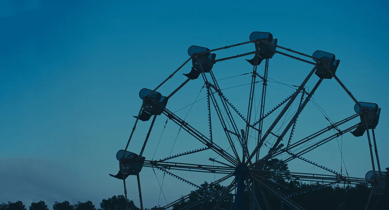 Ferris wheel against a blue sky at the Wolcott Lions Fair